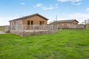 a house with a large yard in front of it at Primrose 1 bed -No Pets-Rose in Eye