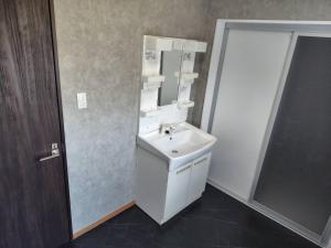 a bathroom with a sink and a mirror at 五島宿Seina in Goto +23 photos