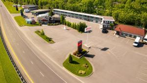 an aerial view of a town with a building and a road at Motel Saint Bruno in Saint-Bruno-de-Montarville