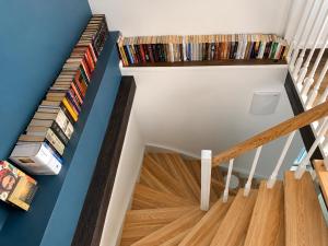 a staircase with cds and dvds at Gedvilų sodyba in Kelmė