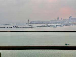 a view of a large body of water with boats at Sapphire Hạ Long Luxury Studio in Ha Long