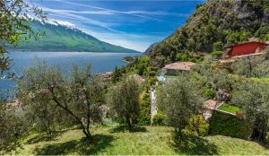 a view of a lake from a hill with trees at Relax Hotel Villa Gardenia & Villa Oleandra in Limone sul Garda