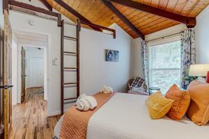 a bedroom with a large bed and a window at The Beech Hut in Beech Mountain