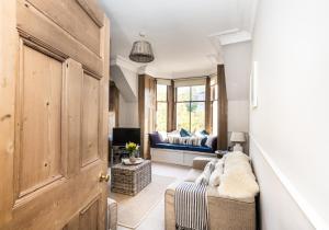 a living room with a couch and a window at The Neuk in North Berwick