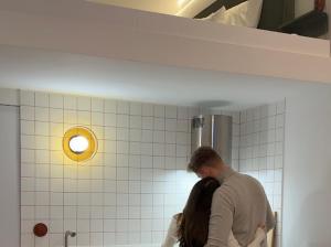 a man and a woman standing in a bathroom at Hvile in Kleszczyn +37 photos