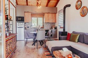 a living room with a couch and a table at Museum Draginë-Guest House in Sukobin