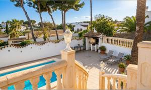 a view of the pool from the balcony of a villa at Vista Portet, sleeps 10, Private Pool, Sea Views, Squash, 1 km from El Portet beach in Teulada