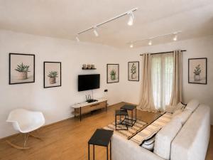 a living room with a couch and a tv at Casa Matthias in Kavadarci