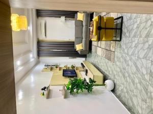 a view of a kitchen with two sinks in a room at Uzzy Homes in Lagos