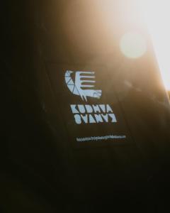a logo on a shirt with the sun in the background at K-Tent 1 in Treknow