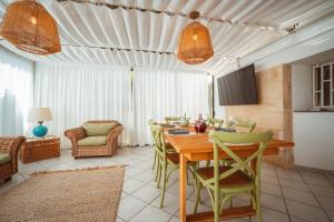 a dining room with a table and chairs at MareLuxe & Pool - Villa By The Sea in Polignano a Mare