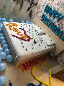a birthday cake sitting on top of a table at Hotel park view in Bathinda