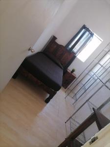 an overhead view of a living room with a couch at Hostal Queretaro LOMAS M in Laborcillas