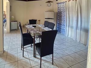 a dining room with a table and chairs at Luxury Oasis Villa in Silver Sands +19 photos