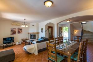 a living room with a table and a couch at Villa Antonela in Divšići