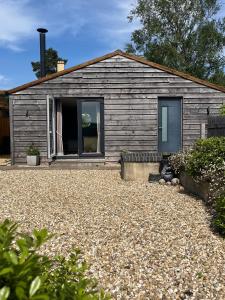 a house with a gravel yard in front of it at Milk Shed in Chard