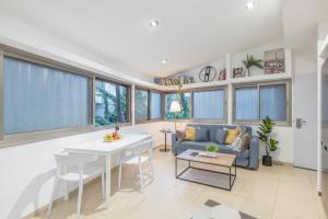 a living room with a couch and a table at Masada34a City Center in Haifa