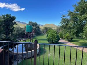 a view of a garden from a balcony at Emmanuel Guest Villa in Thabazimbi