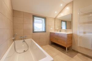 a large bathroom with a tub and a sink at Villa Mareyland Saint-Jorioz, in Saint-Jorioz +38 photos