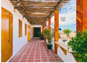 a walkway in a house with a view of the beach at Blue Sea Homestay 2 in Phu Yen