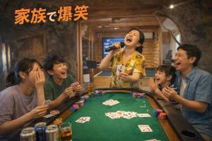 a group of people sitting around a poker table at AJITO Chigasaki in Chigasaki