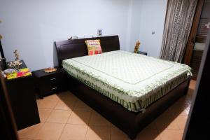 a bedroom with a bed in a room at Apartment Simon - Berat City Center in Berat