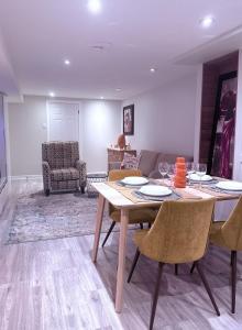 a dining room with a table and chairs at Large Private Suit With Free Parking in Mississauga