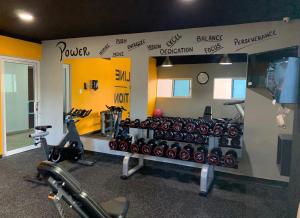 a gym with a bunch of exercise equipment in it at City Oasis in Santo Domingo