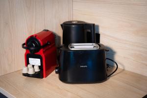a coffee maker sitting on top of a table at Black Wood Tiny House in Mendig - Eifel Escape in Mendig