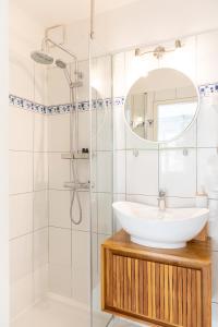 a bathroom with a sink and a shower at Apartments Olive Tree in Hvar +37 photos