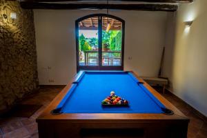 a pool table with a bowl of fruit on it at Ca L'Avi in Ca l’Avi