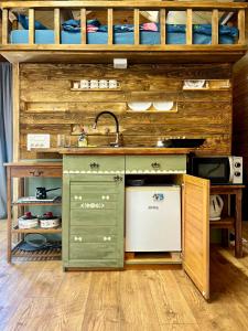 a kitchen with a sink and a dishwasher at House by the river in Ptuj
