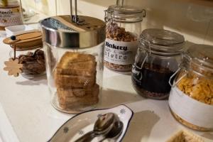 a counter with jars of bread and other food items at C'era Una Volta B&B in Perugia