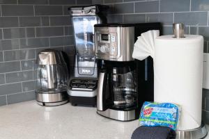 a kitchen counter with a coffeemaker and a coffee maker at 103 Kihei Holiday in Kihei