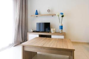 Televízia a/alebo spoločenská miestnosť v ubytovaní Cabo Roig La Rotonda, Pool, Beach & Comfort