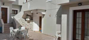a dining room with a table and chairs at Chorio traditional apartment in Kalymnos