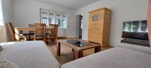 a living room with a couch and a table at Hirschhäusl in Großschönau
