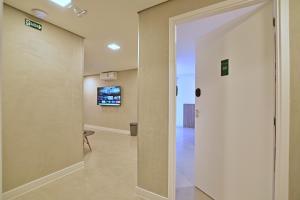 an open door to a hallway in a building at Premium Office-My Stay 02 in Brasília +39 photos