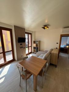 a living room with a couch and a table at Casa Serena - Sarnico in Sarnico