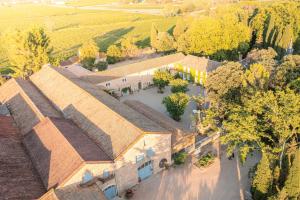 an overhead view of a school building with a parking lot at Château Pech-Céleyran in Salles-dʼAude