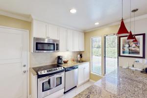 a kitchen with a stove and a microwave at Silverado Resort and Spa 374 & 375 in Napa
