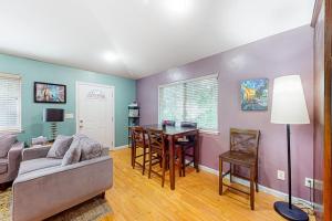 a living room with a couch and a table at Old River Hideaway in Guerneville