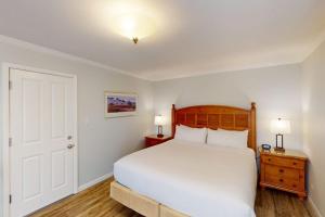 a bedroom with a large white bed and two lamps at Silverado Resort and Spa 354 in Napa