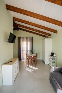 a living room with a table and a couch at Villa Nigro in Laureana Cilento