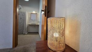 a cylindrical lamp sitting on a table in a room at Reserva Cambucá - Afeto, Pessoas e Sabores in Itirapina +62 photos