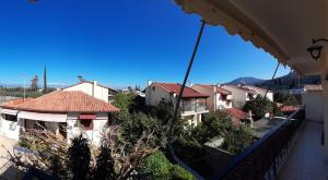a view of a town from a balcony at Real Apartment Αληθινή Διαμονή in Diakopto