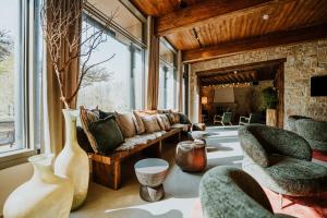 a living room with a couch and chairs at WALDGUT Naturresort in Bad Gottleuba