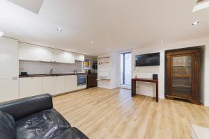 a living room with a couch and a kitchen at Best view Giovinazzo in Giovinazzo