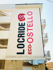 a large sign on the side of a building at eco-Ostello LOCRIDE in Locri