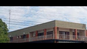 a building with a balcony on top of it at Pousada da Lú in Jaguarão